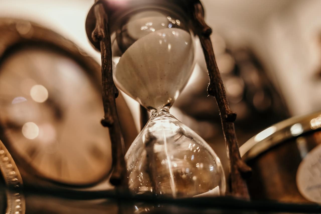 sand timer among clocks