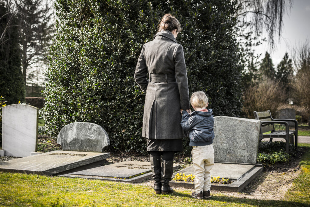 Many clients ask what are the chances of winning a wrongful death suit in Nevada? Pictured here is a mother and child at a gravesite before deciding to pursue a wrongful death suit.
