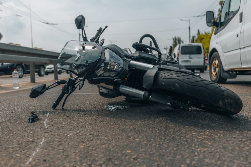motorcycle-lying-on-pavement Best Nevada Reno Motorcycle Accident Lawyer Award for 2023